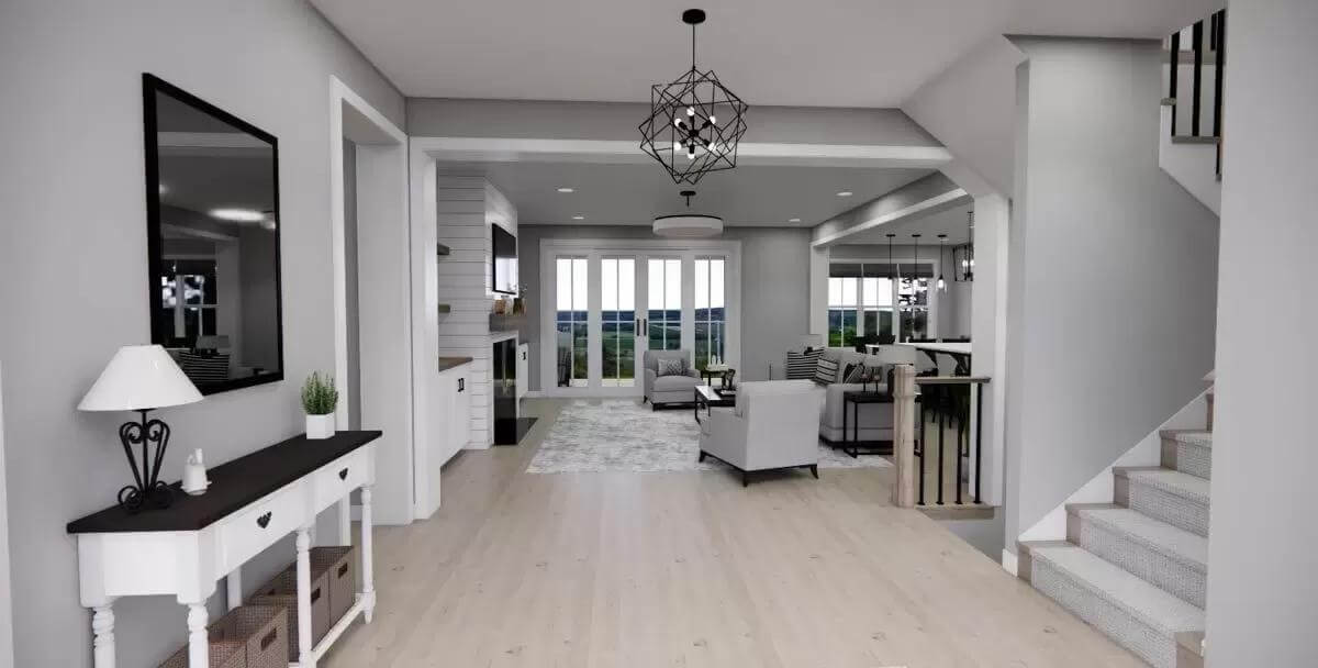 Foyer with a console table and a staircase leading to the upstairs bedrooms.