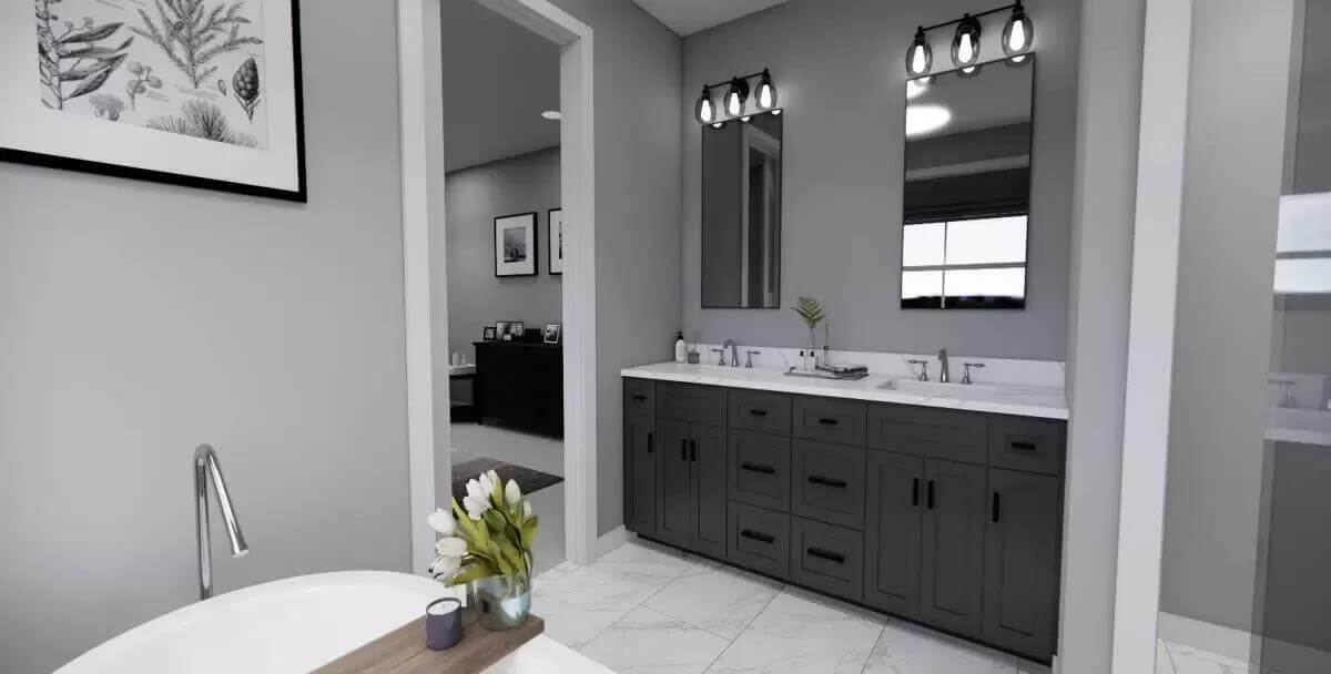 Primary bathroom with a soaking tub and a dual sink vanity.