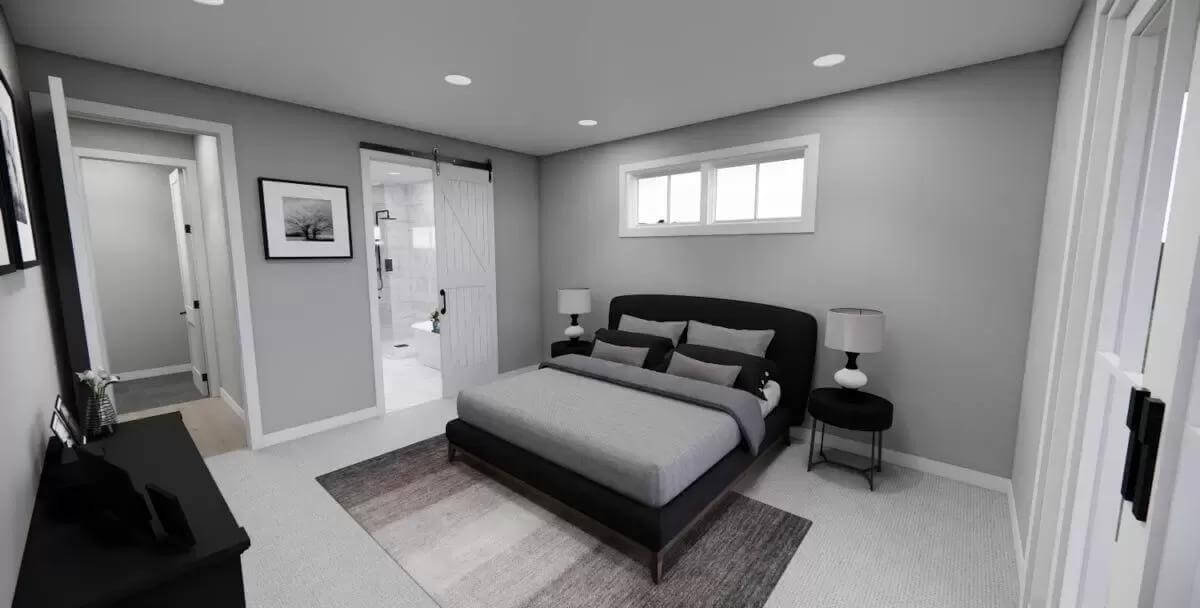 Primary bedroom with a platform bed and an ensuite bath with a sliding barn door.
