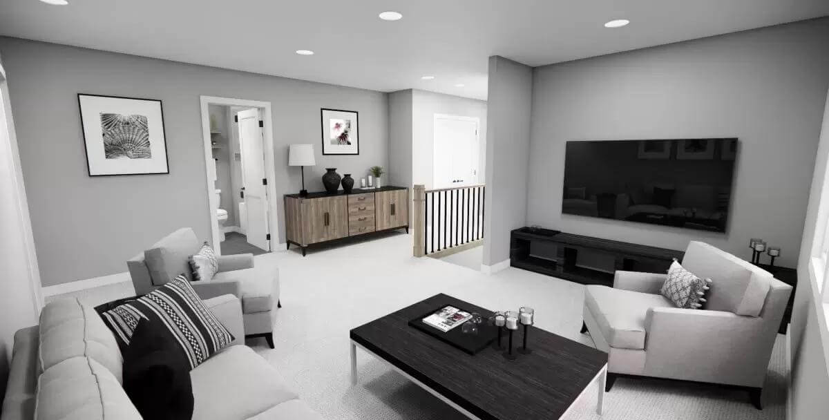 Loft with gray seats and a wall-mounted TV.