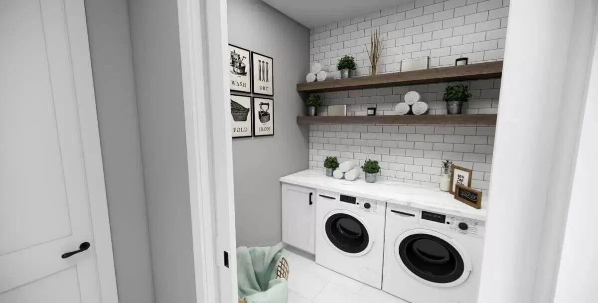 Laundry room with a marble countertop and floating shelves fixed against the subway tiled backsplash.