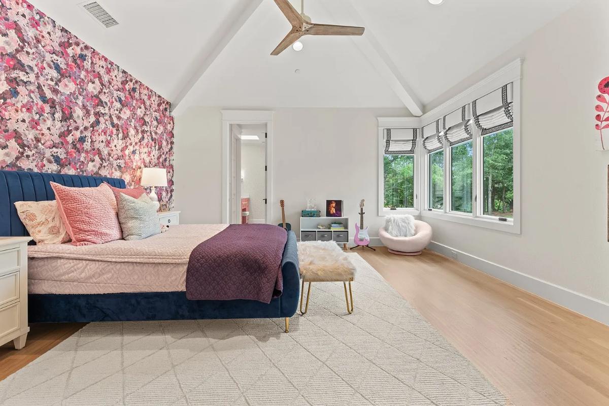Bedroom with hardwood floors and glass windows.