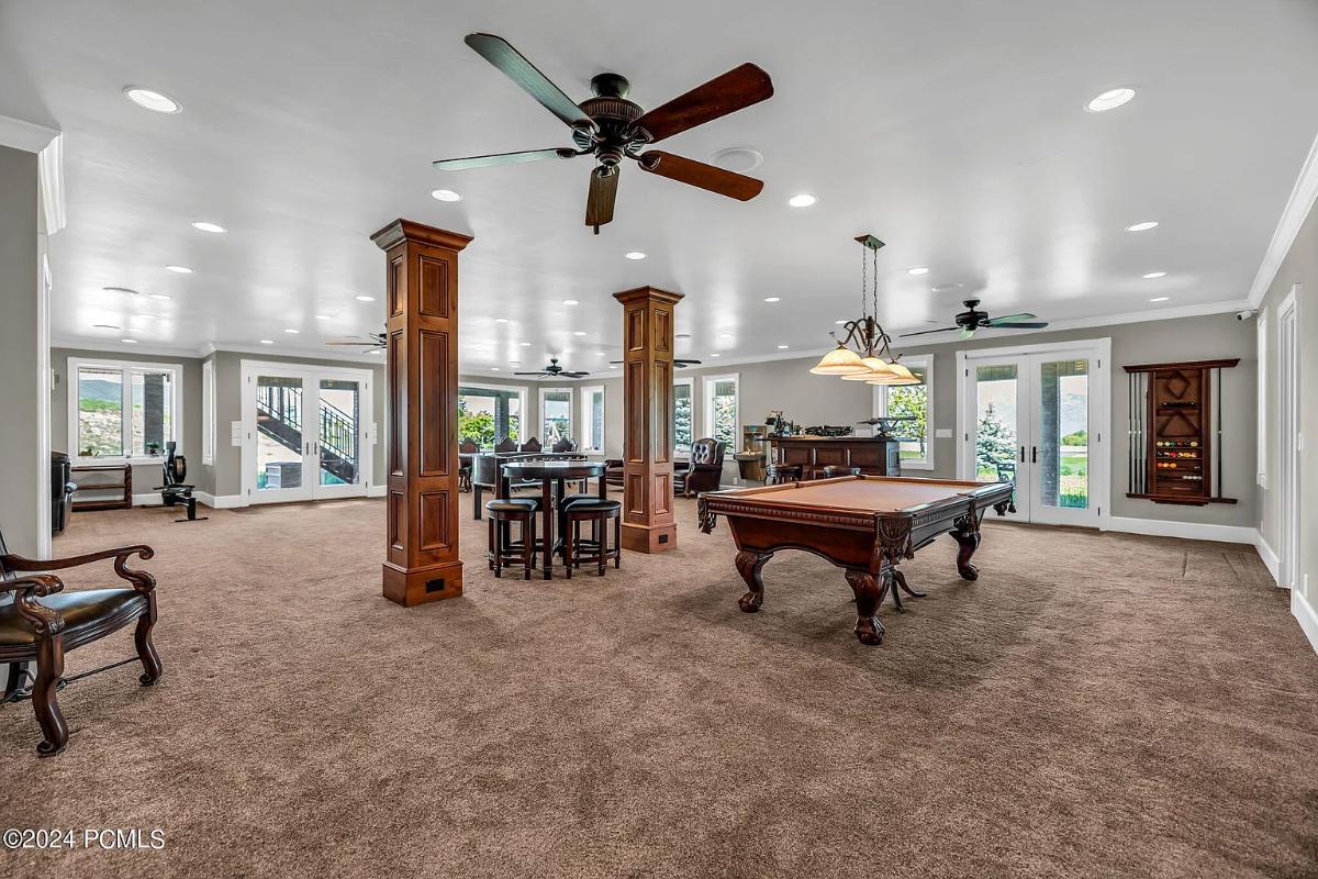 Recreation room with a billiards table.