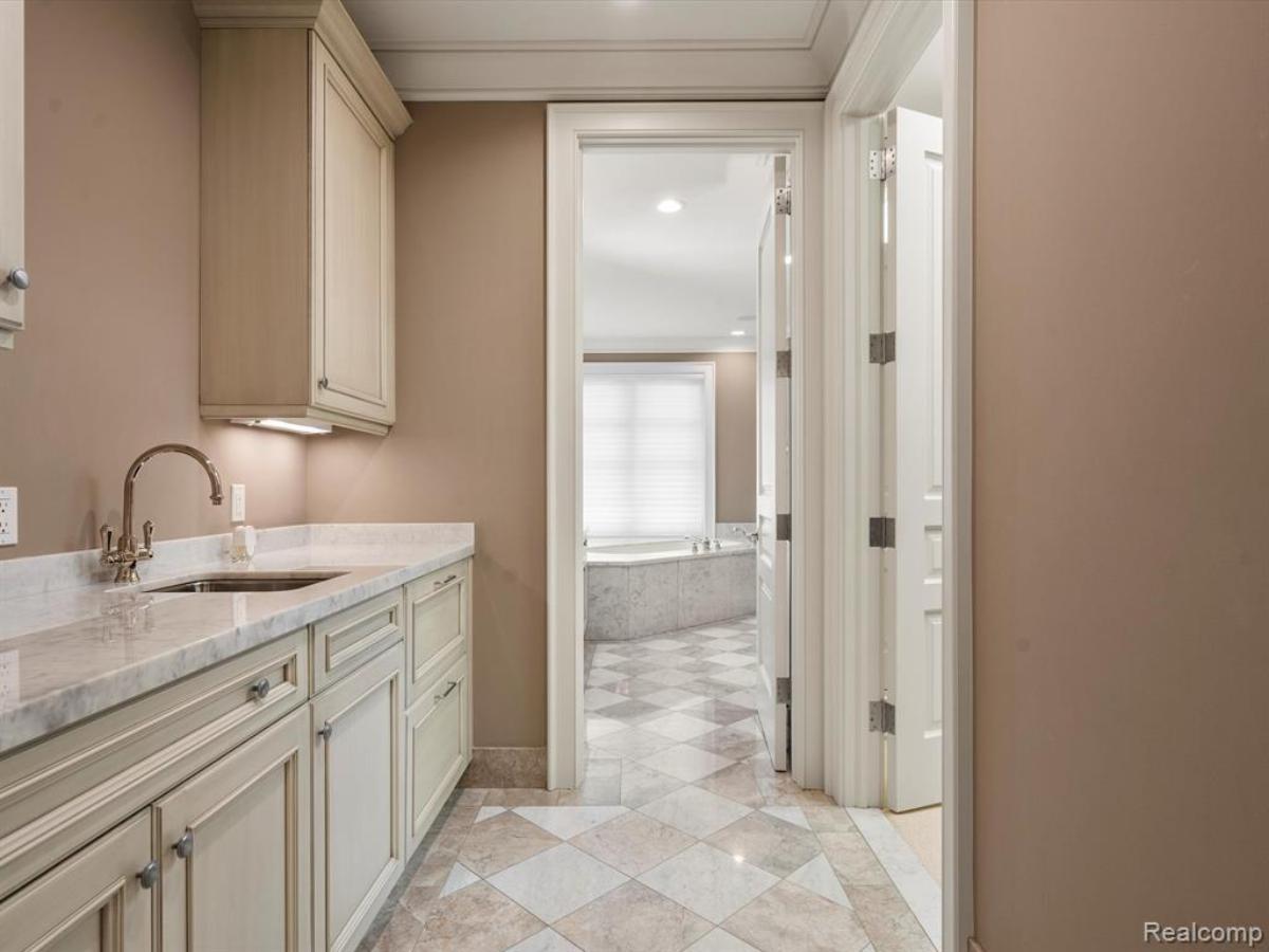 Bathroom with a custom-made vanity and a soaking tub.