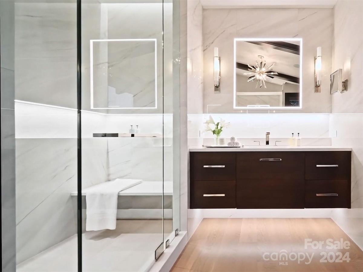Bathroom with a sink and a walk-in shower.
