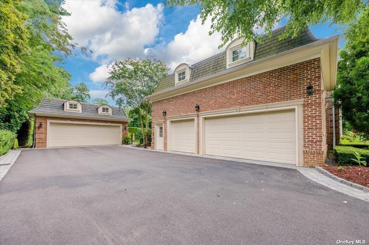 Garage with spacious driveway.