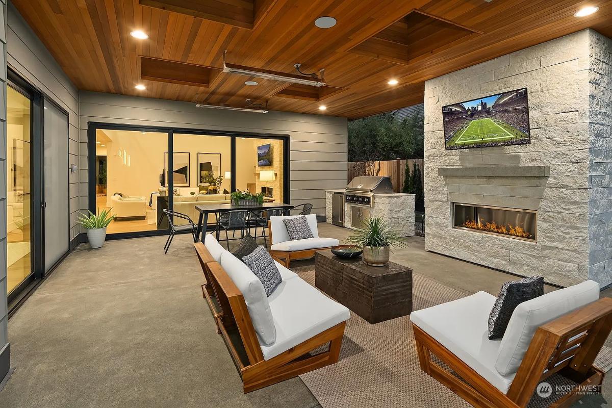 Outdoor living space with a fireplace.