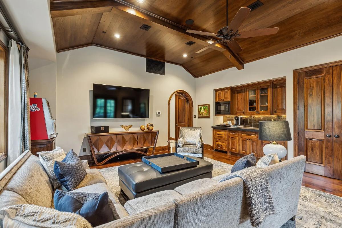 Family room with couches and a TV.