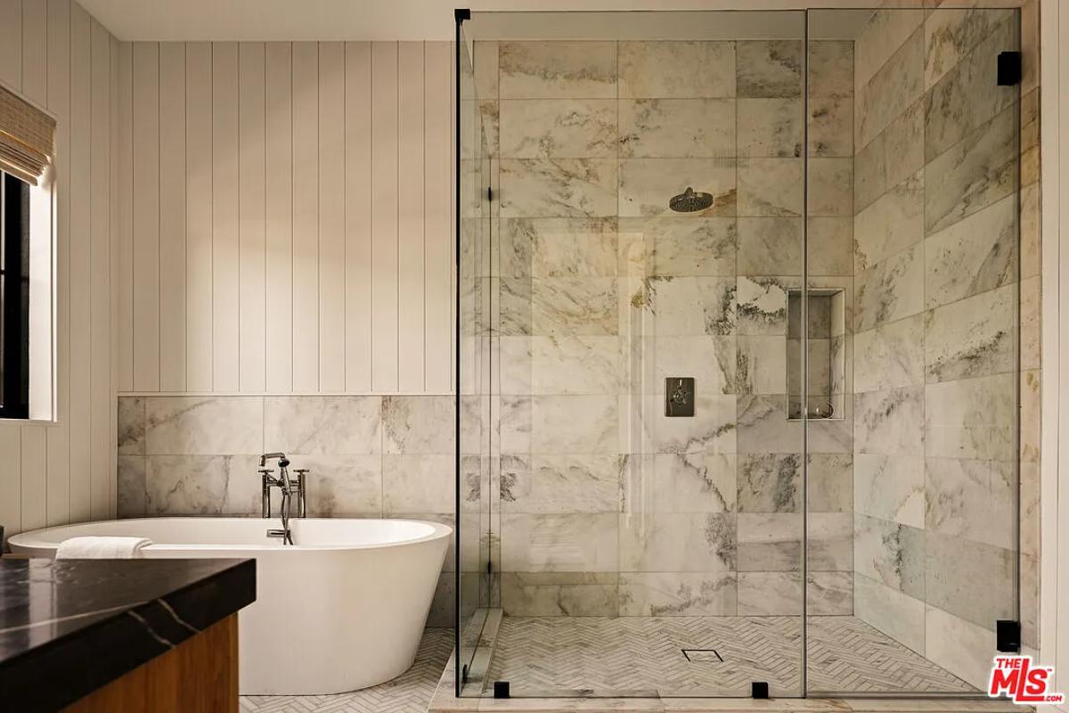 Bathroom with a soaking tub and a walk-in shower.