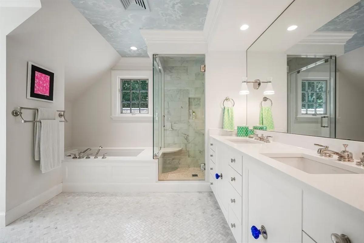 Bathroom with a sink, a soaking tub and a walk-in shower.