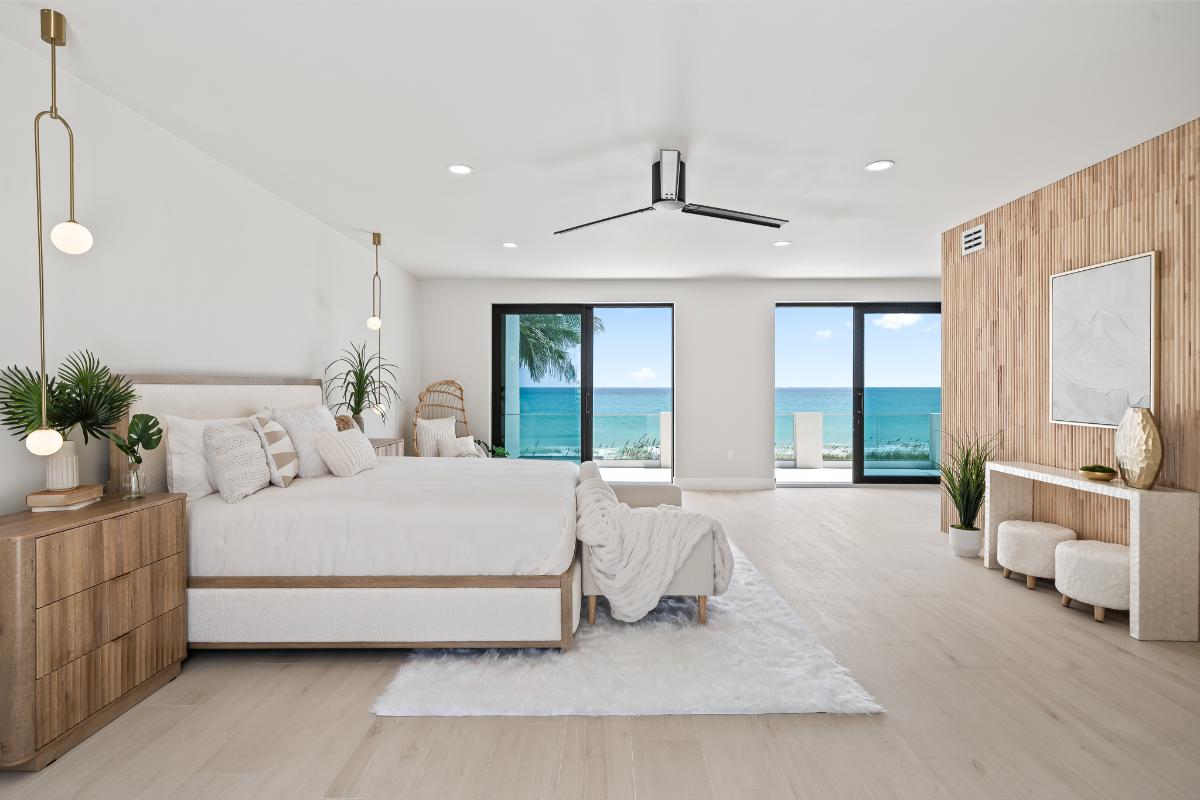 Bedroom with hardwood floors and sliding glass doors.