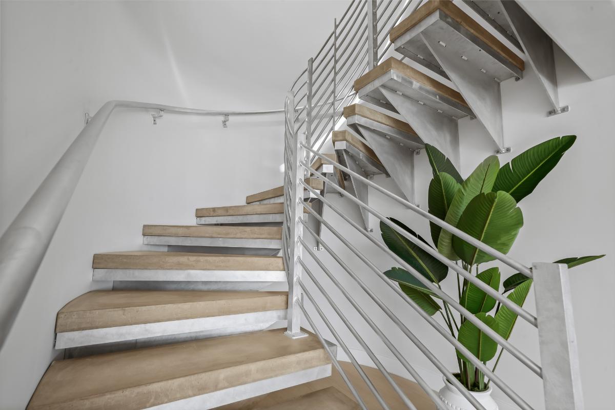 Stairs with metal railings.