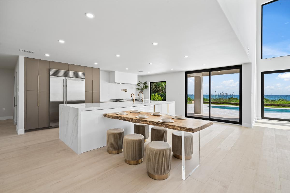 Kitchen with custom cabinetry, a breakfast nook and a center island prep area.