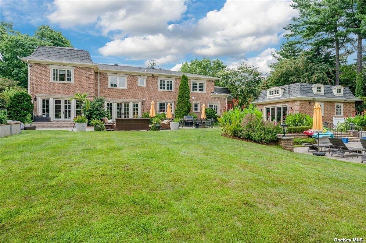 Rear view with a large green lawn.