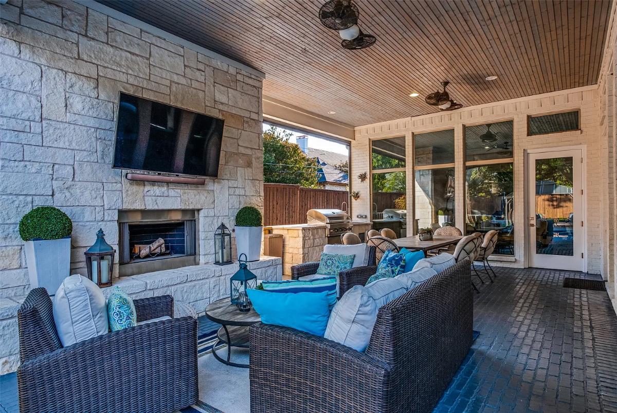 Outdoor living space with a fireplace.