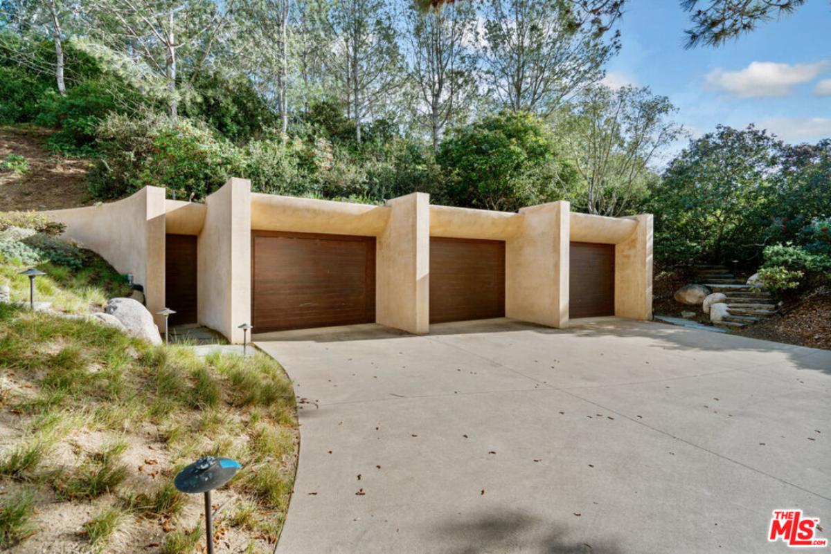 Garage with a spacious driveway.