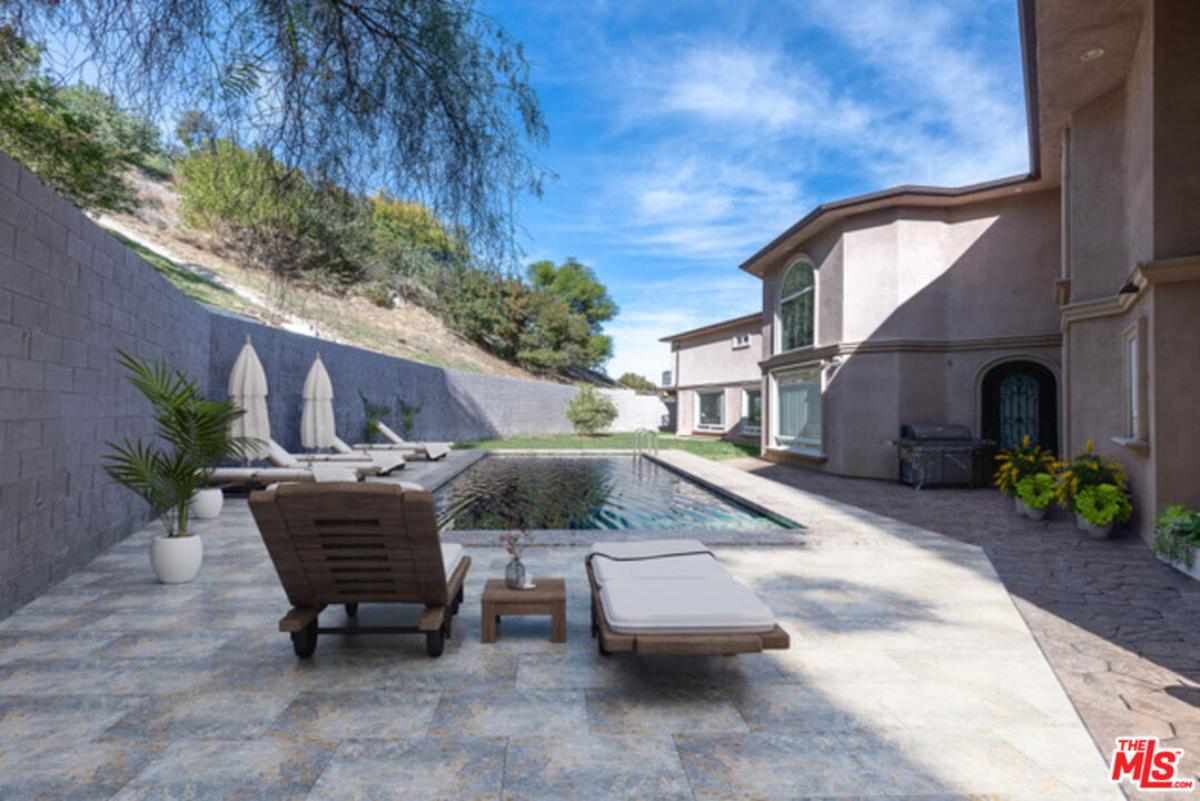 Pool with lounge chairs.