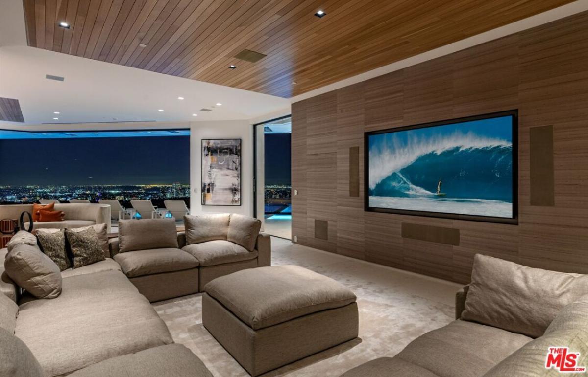 Family room with couches and a TV.