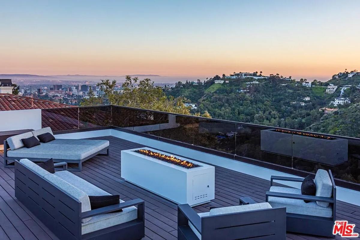 Rooftop deck with a fire pit.