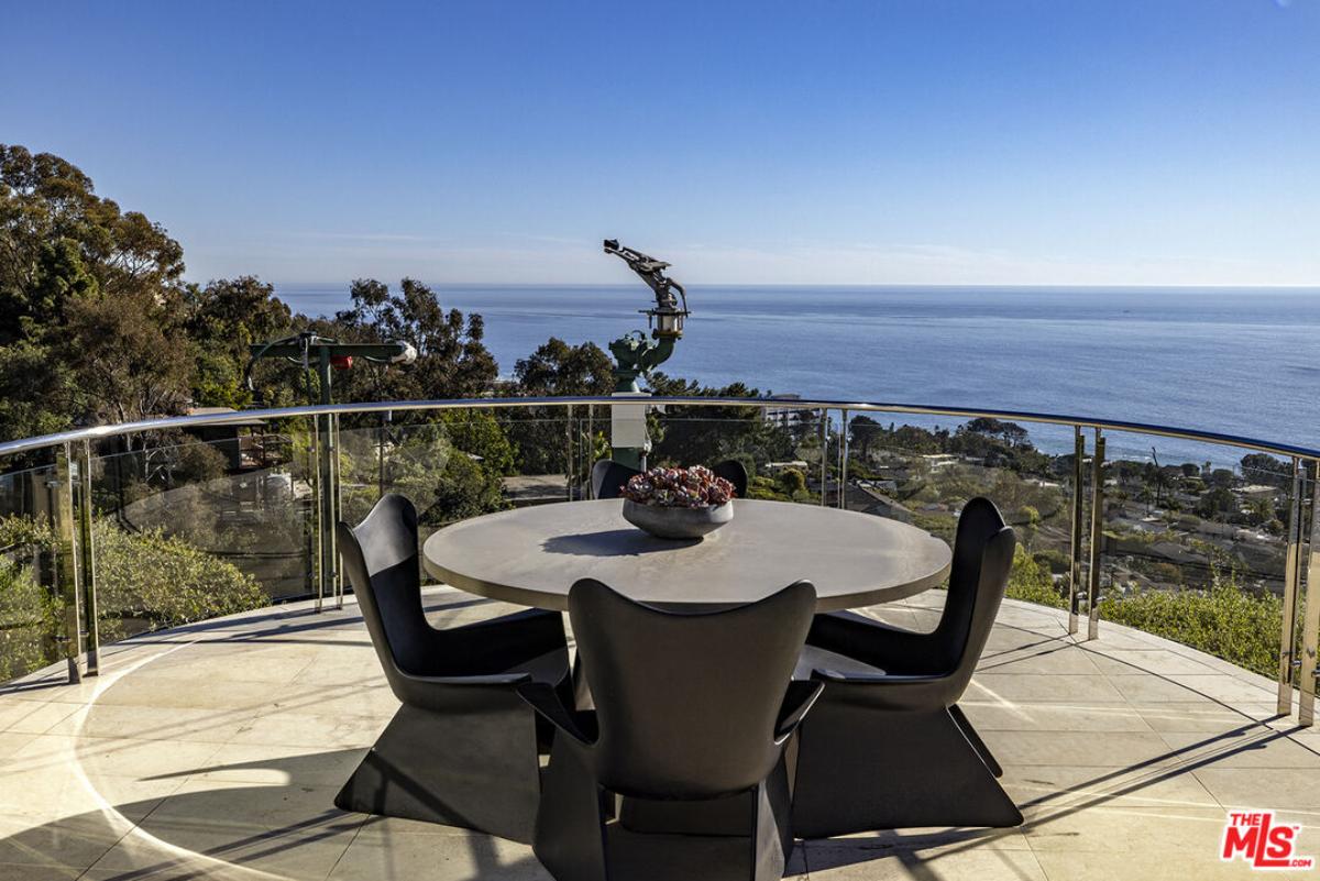 Outdoor dining area with an ocean view.