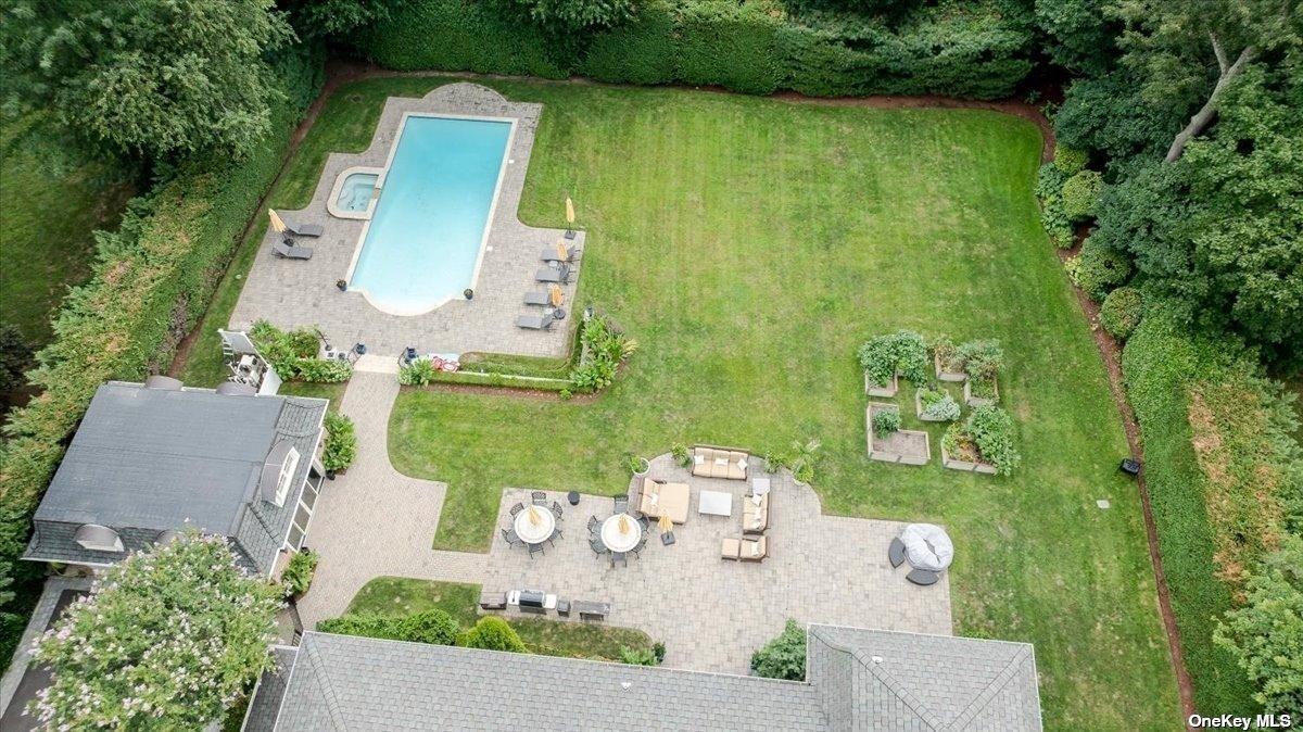 Aerial view of the property with a pool.