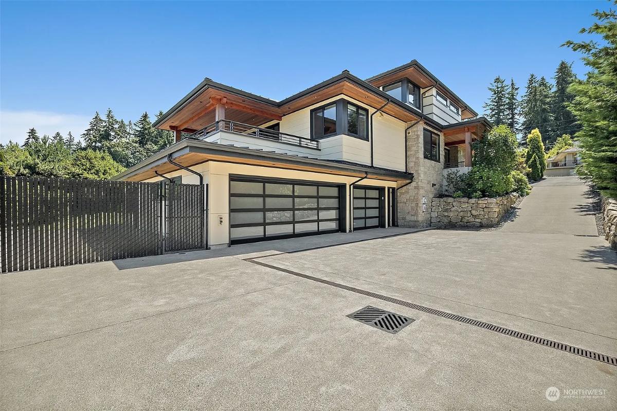 Garage with a spacious driveway.
