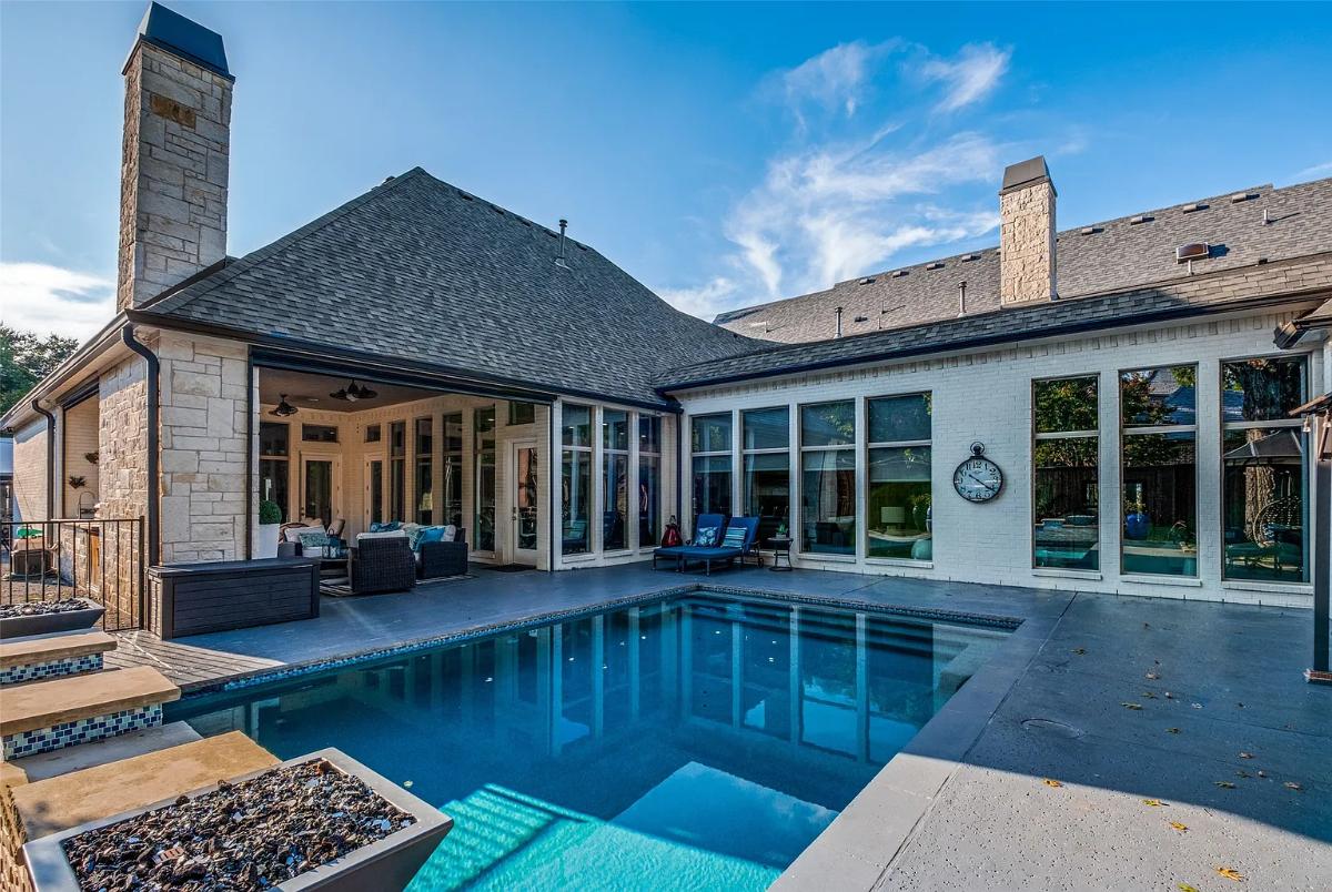 Rear view of the mansion with a pool.