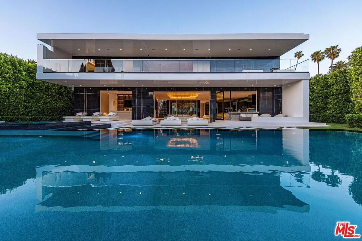 Rear view of the mansion with a pool.