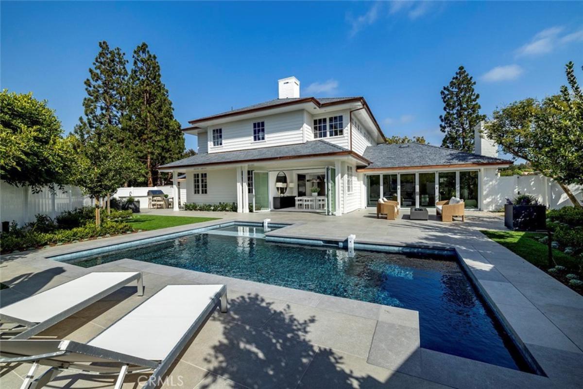 Rear view of the mansion with a pool.
