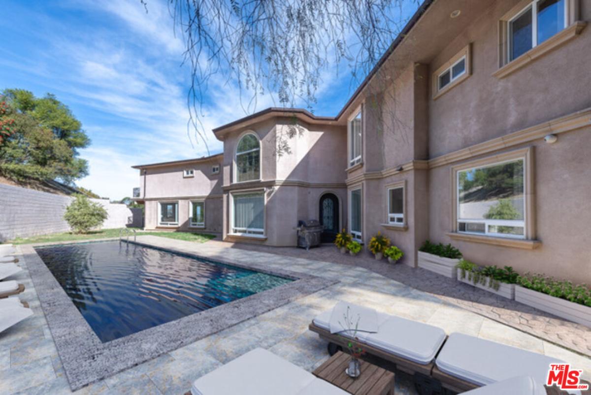 Pool with lounge chairs.