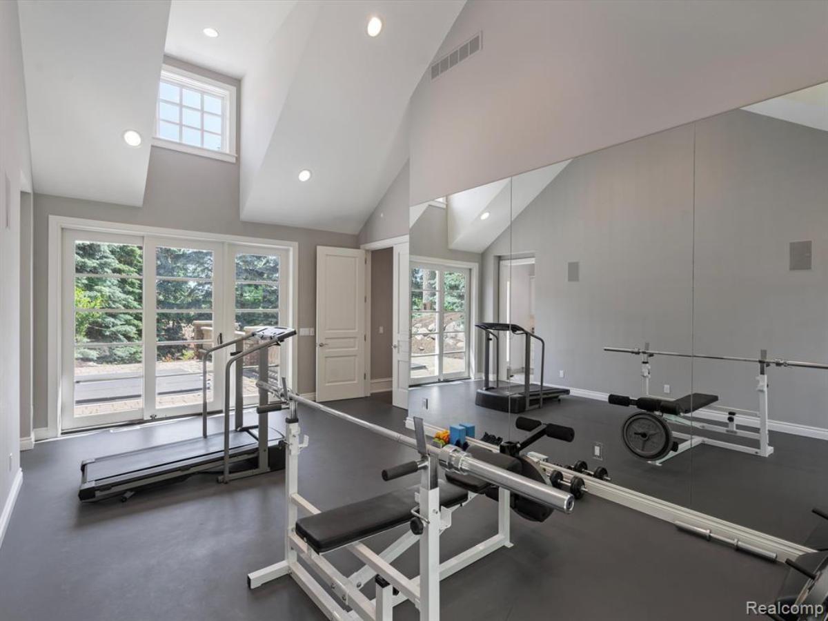 Home gym with glass walls.