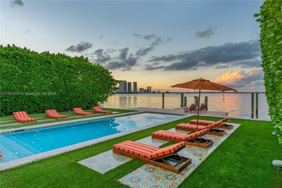 Pool with lounge chairs.