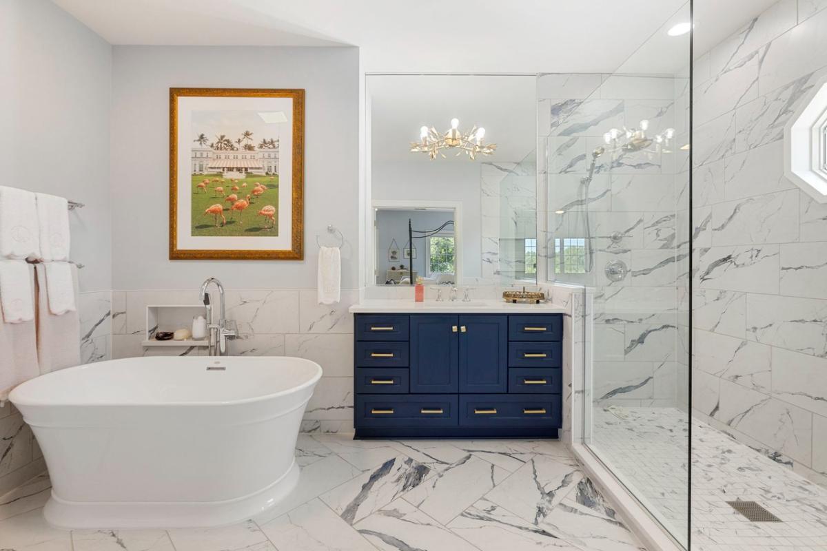 Bathroom with a custom-made vanity, a soaking tub and a walk-in shower.
