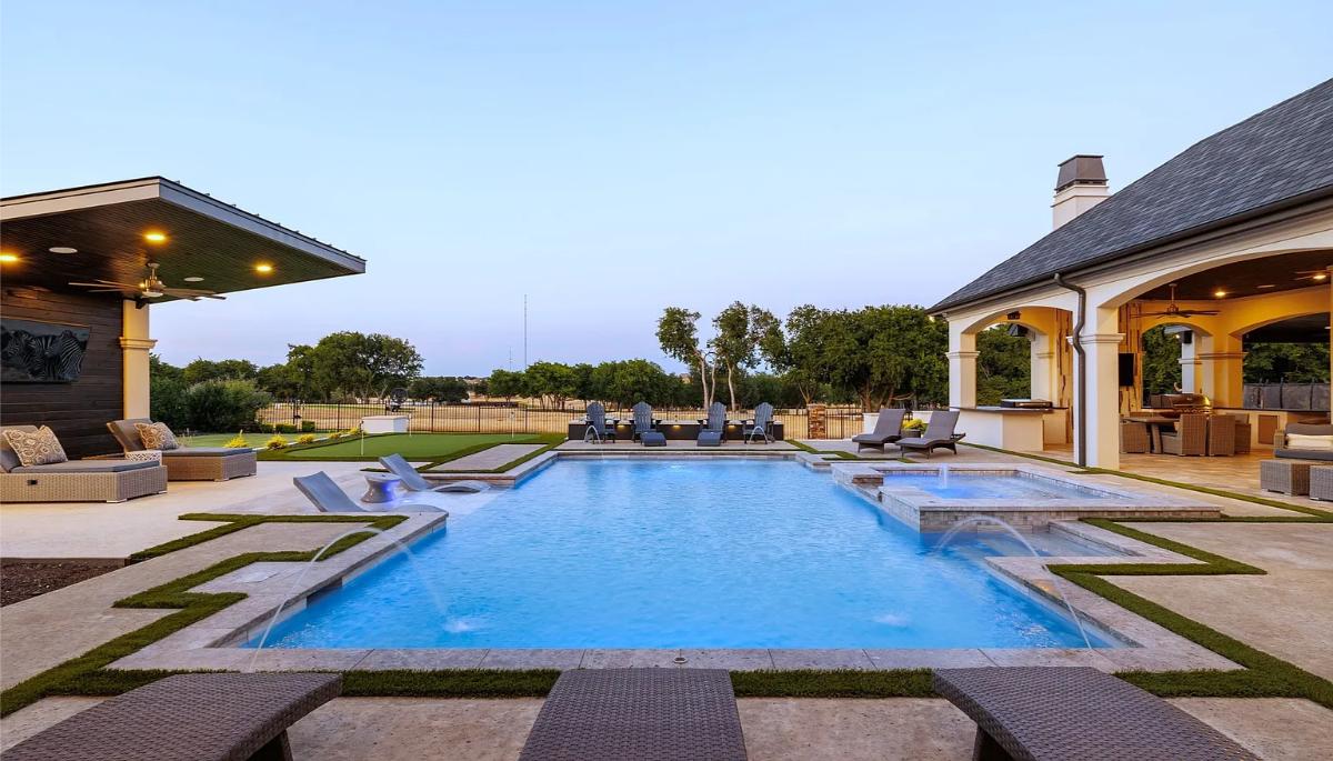 Pool with lounge chairs.