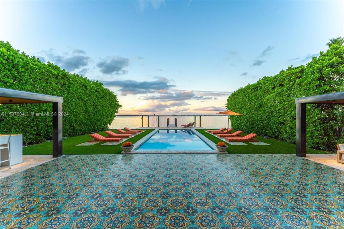 Pool with lounge chairs.