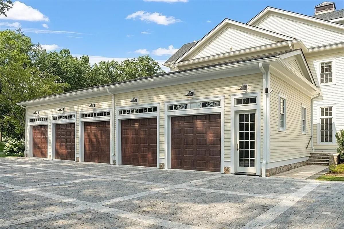 Garage with a spacious driveway.