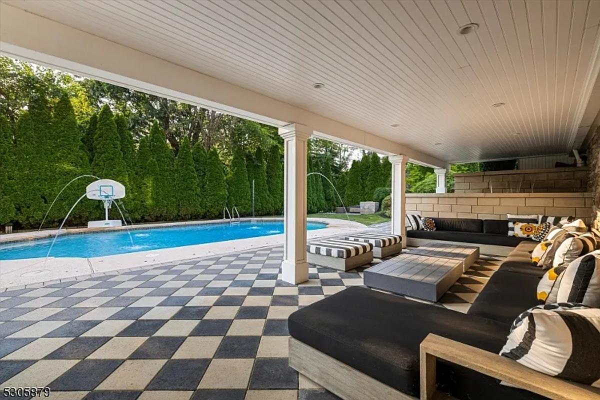 Outdoor living space adjacent to the pool.