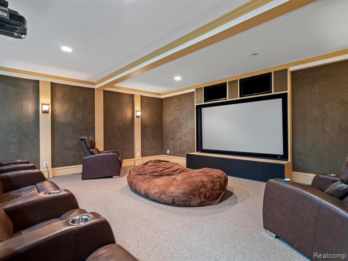 Home theater with carpet flooring.