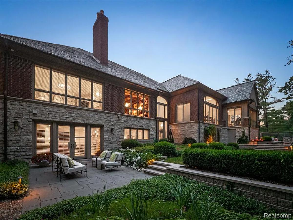 Rear view of the mansion with a patio.
