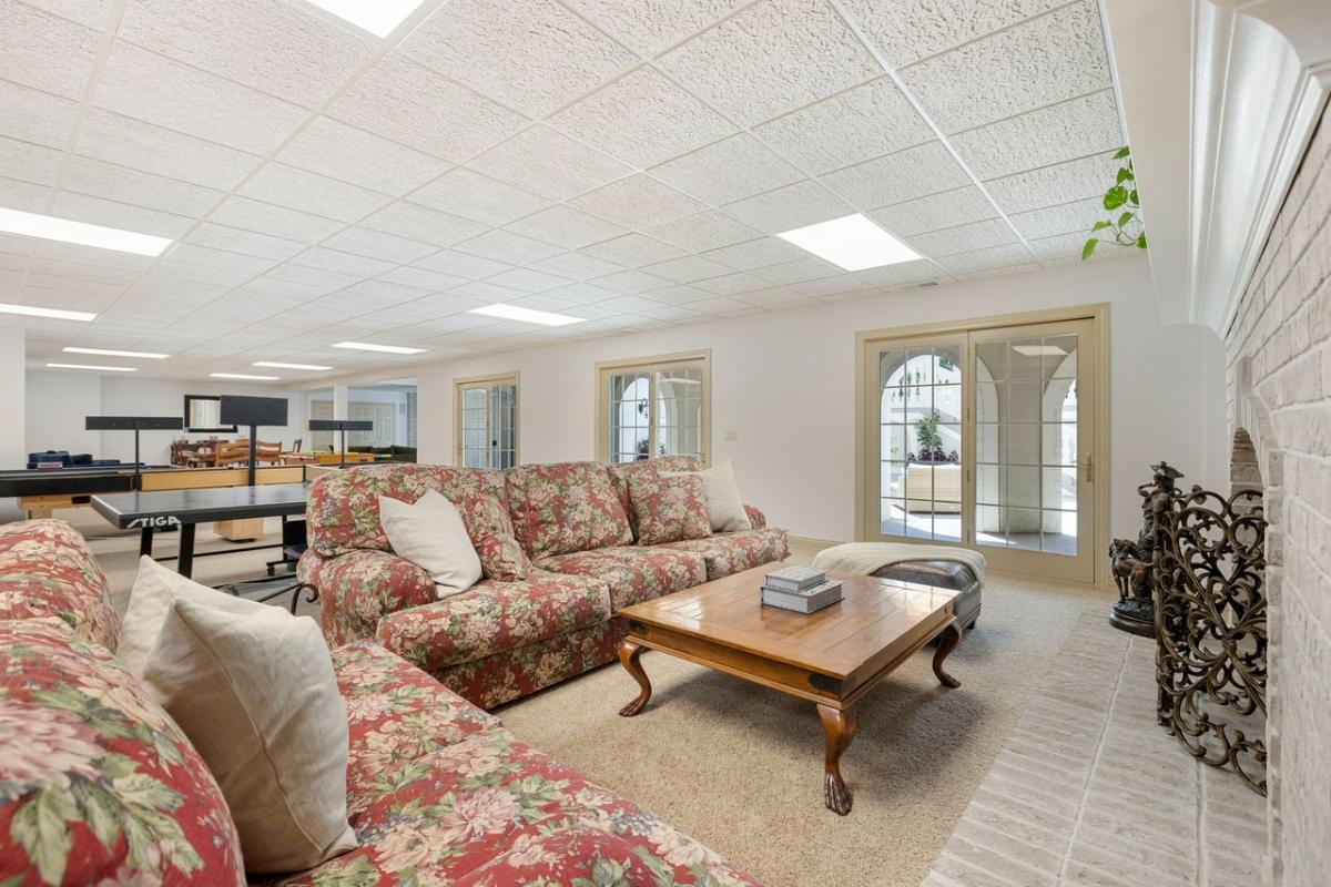 Recreation room with a fireplace.