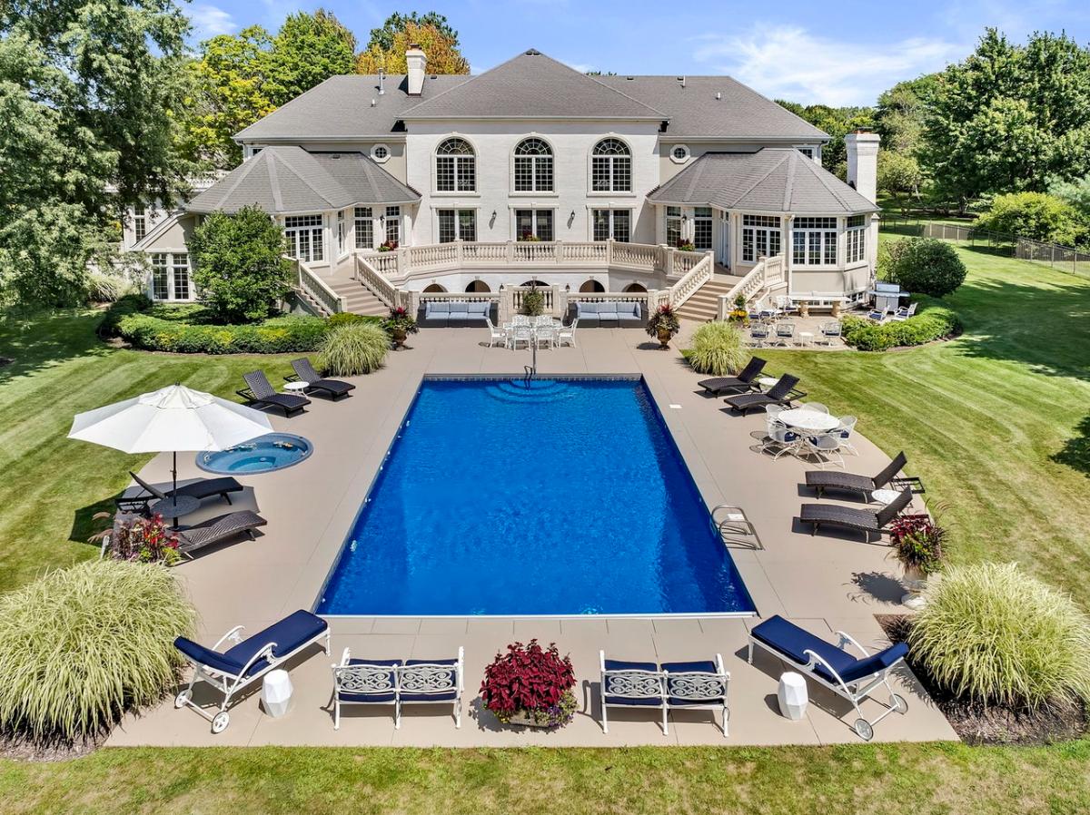 Rear view of the mansion with a pool.