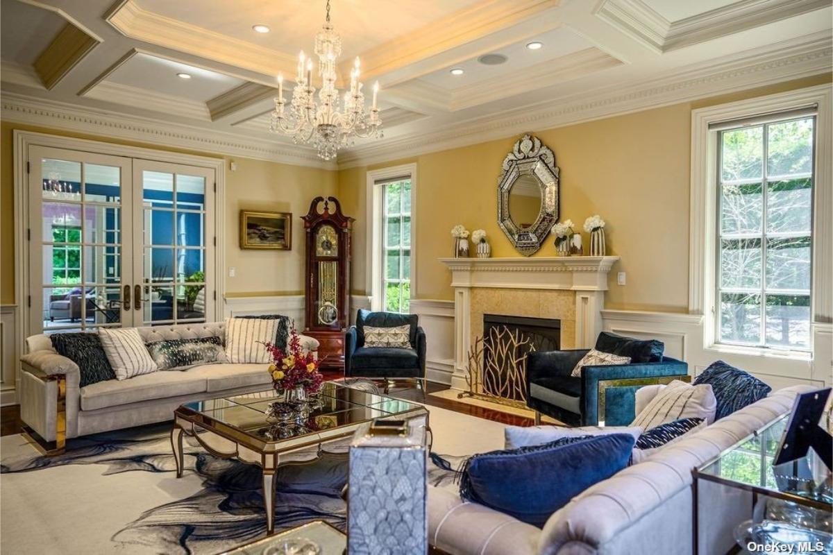 Living room with couches and a fireplace.