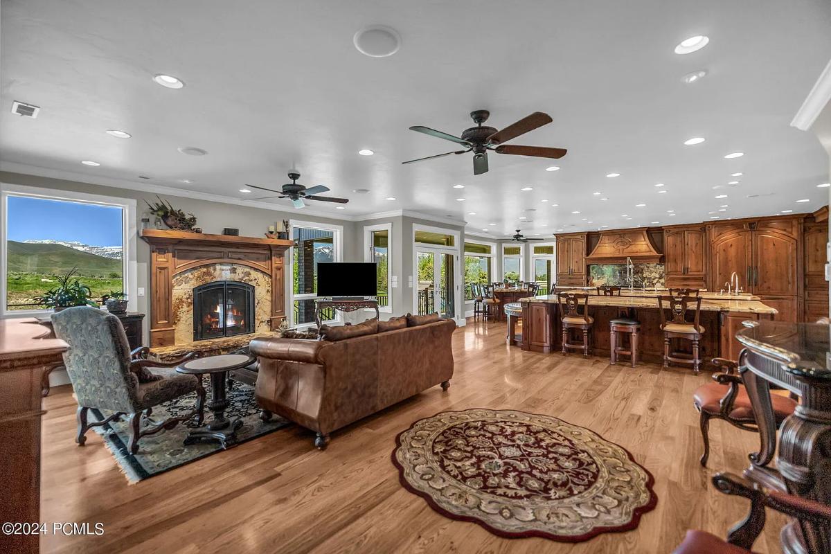 Living room with couches and a fireplace.