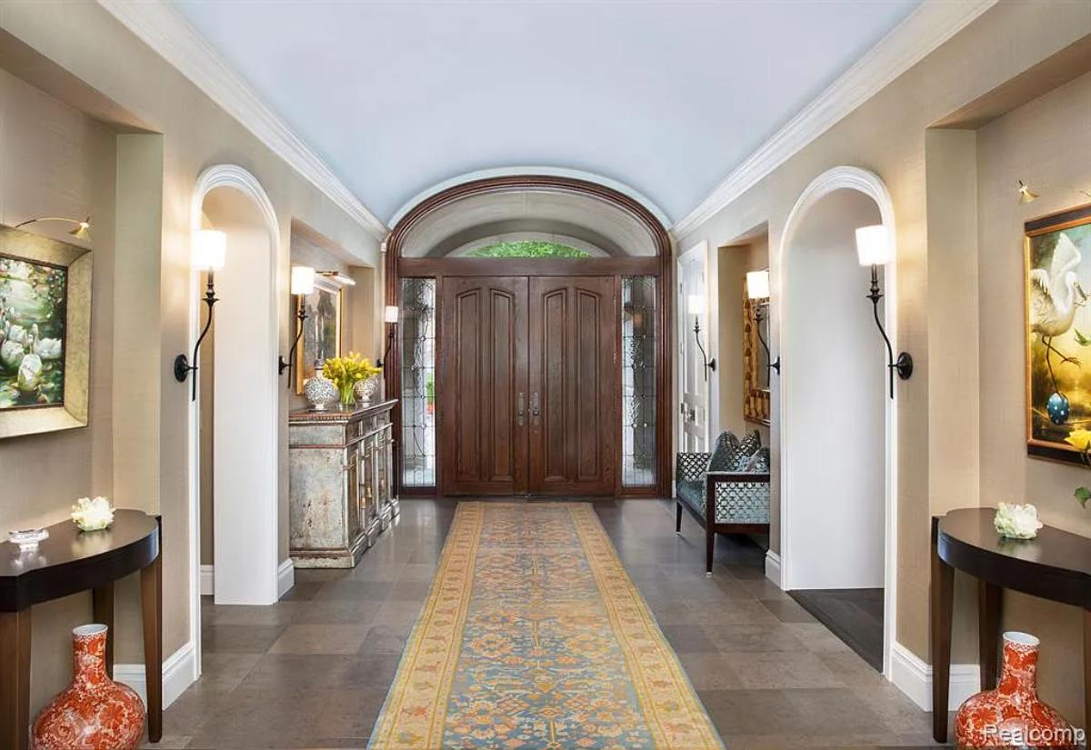 Foyer with hardwood doors.
