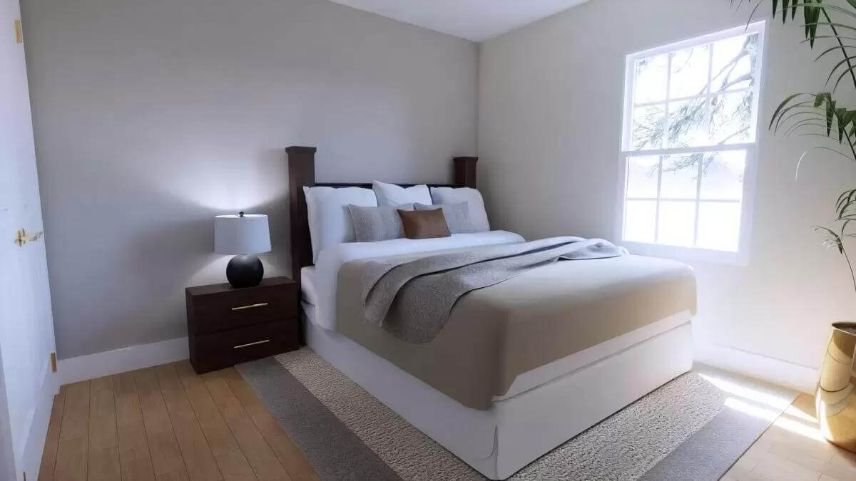 Bedroom with a platform bed and a white-framed window.