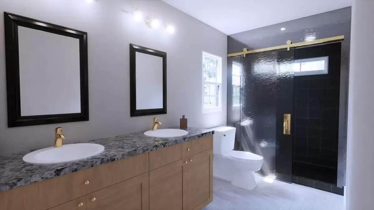 Primary bathroom with a dual sink vanity, a toilet, and a tiled shower.