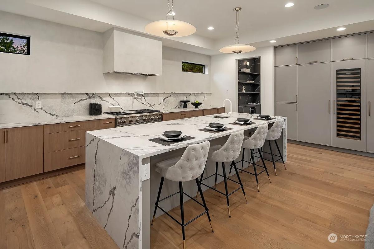 Kitchen with custom cabinetry and a counter breakfast bar.