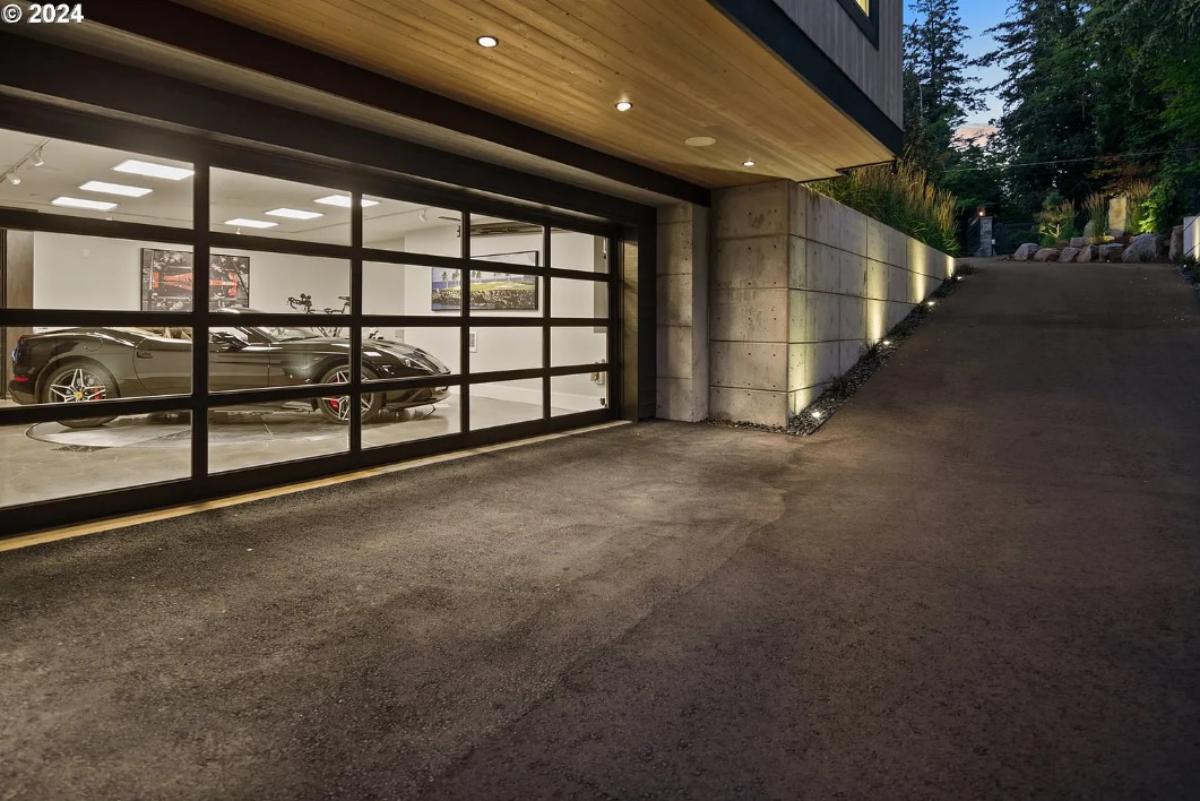 Garage with a spacious driveway.