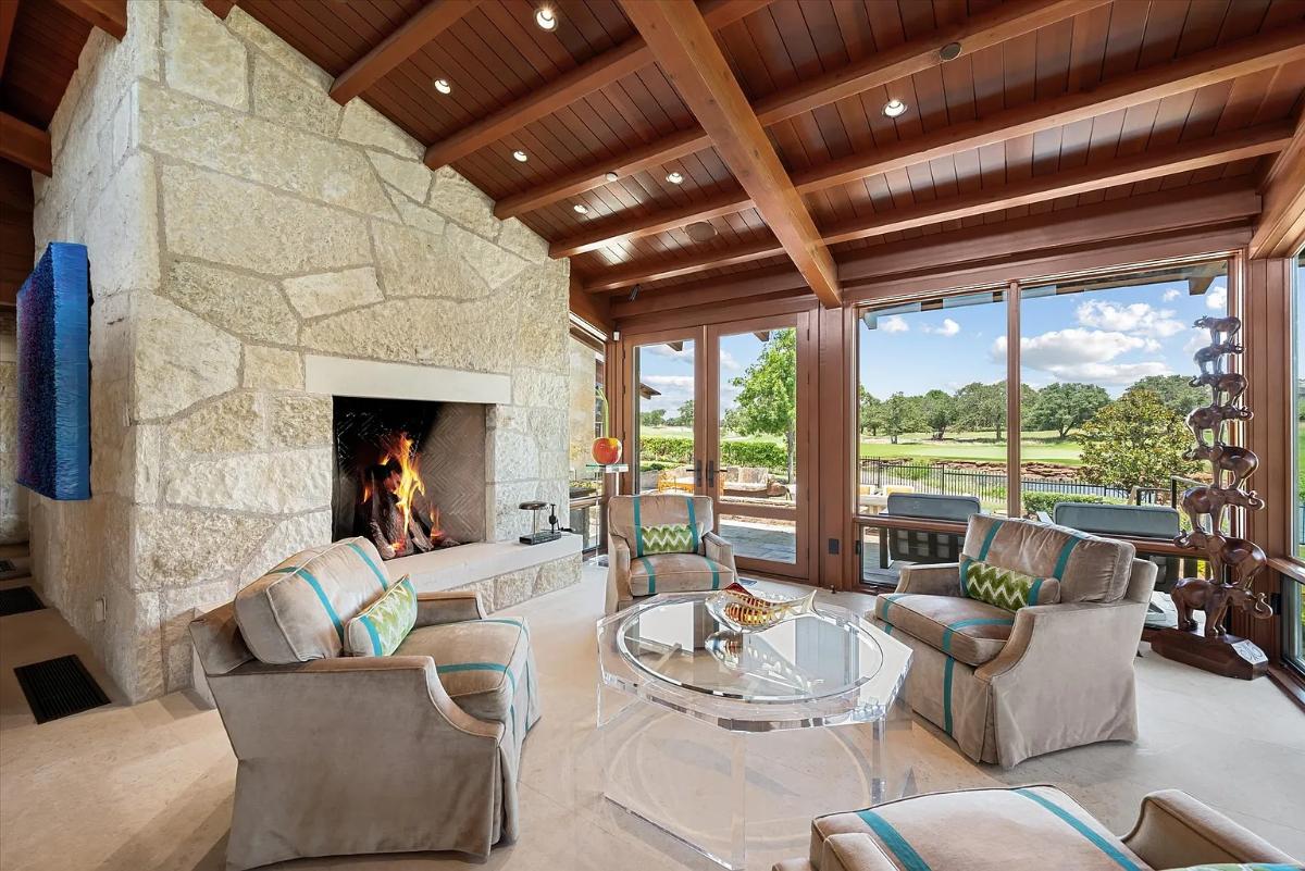 Living room with couches and a fireplace.
