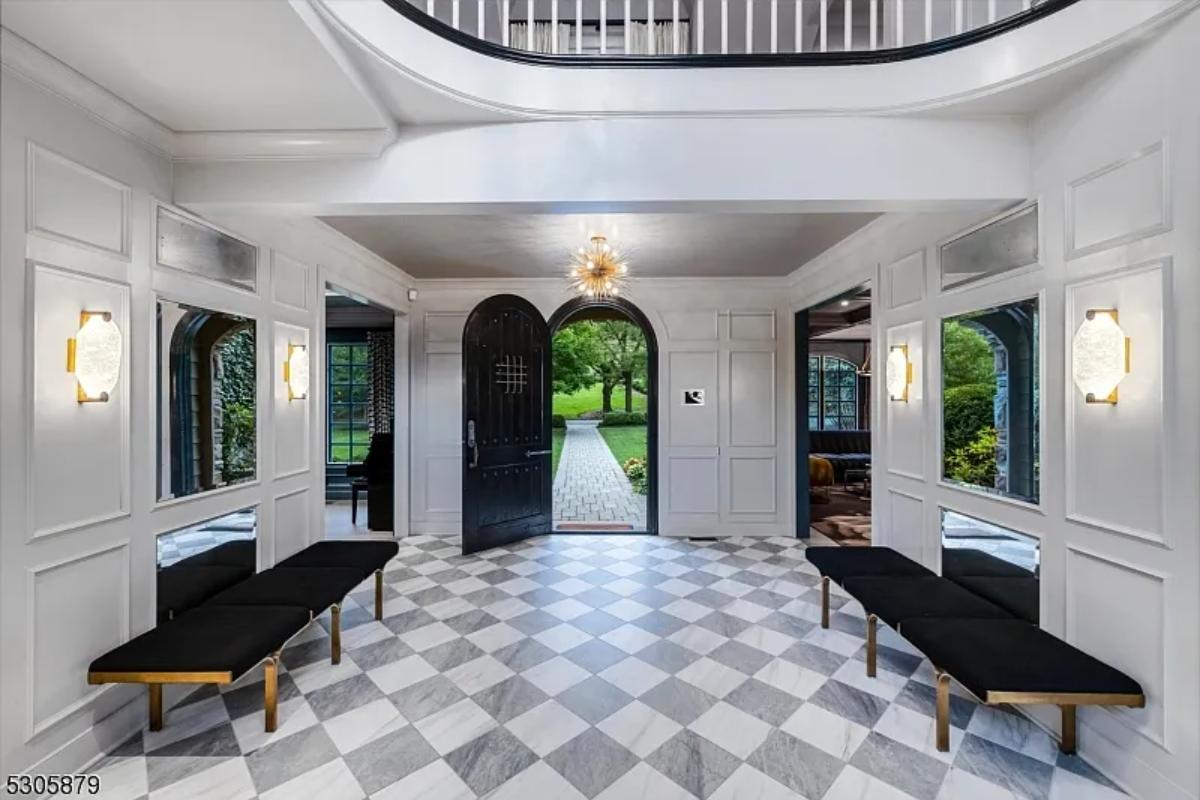 Foyer with benches and custom lighting.